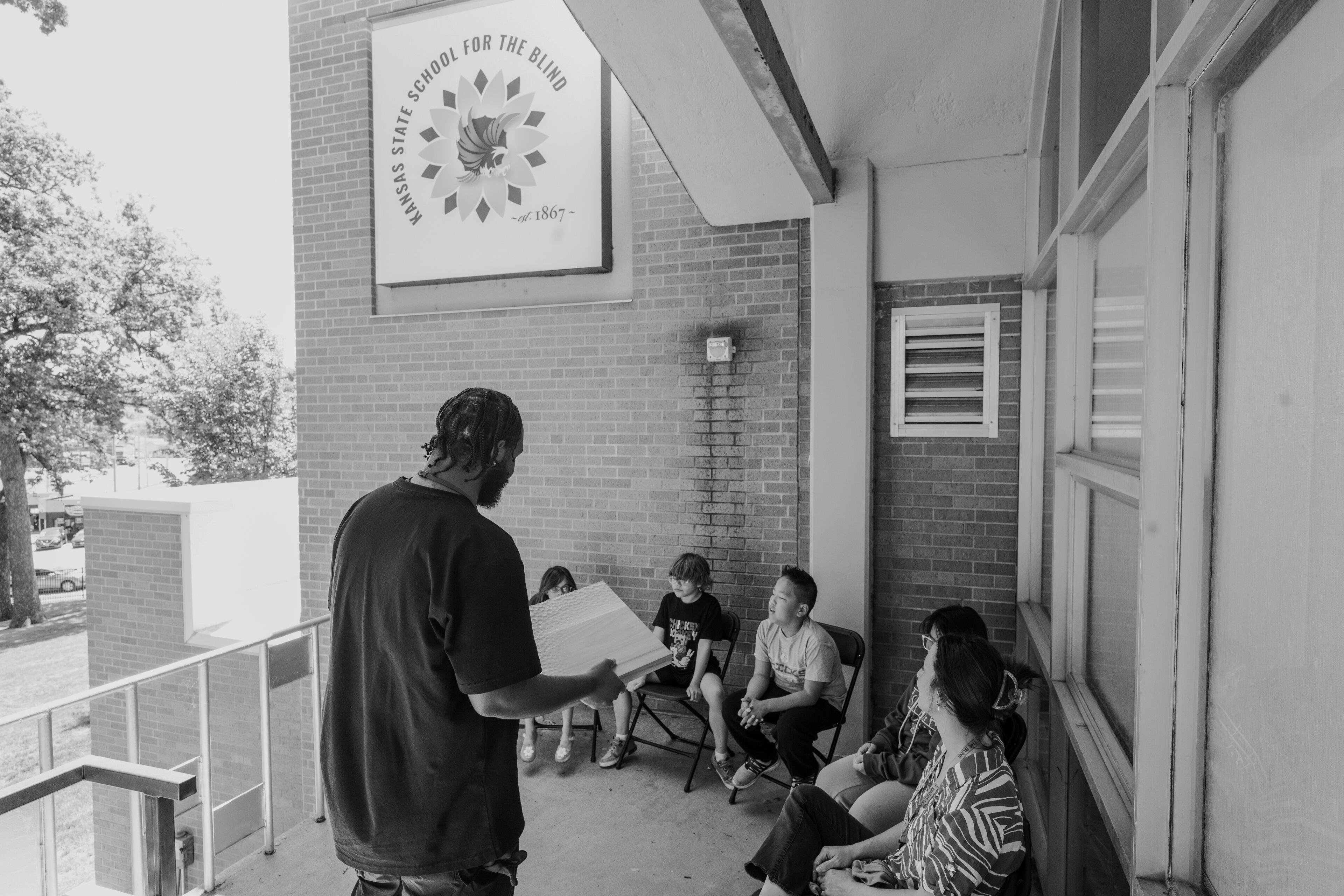 Founder Aaron McIntosh presenting archived directional texture prototypes to Kansas State School of the Blind Students.